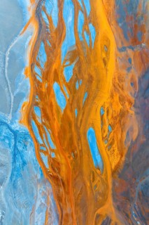 This stunning aerial photograph captures a multicoloured landscape, showcasing an intricate mix of