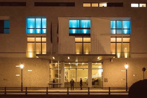 The windows of the French Embassy are illuminated in blue and yellow out of solidarity during the