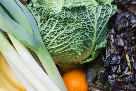 A vibrant mix of fresh produce featuring a variety of colorful fruits and vegetables. This