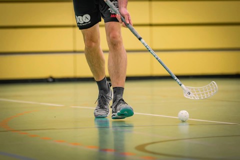 Close-up of a floorball player playing in a sports hall, Foolball, Calw, Germany