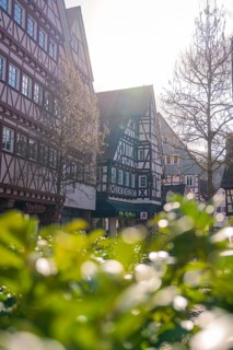 Idyllic old town with half-timbered houses and bright sunshine, Calw, Black Forest, Germany