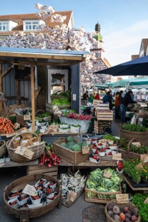 April 18, 2026: Weekly market at marketplace with fresh fruits, vegetables, cherry blossoms and