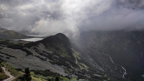 Mountain landscape with dramatic clouds and light over a valley, Zakopane, Morskie Oko hiking in