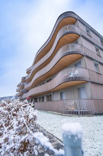 Modern residential building with wooden elements in snowy winter, Nagold, Black Forest, Germany