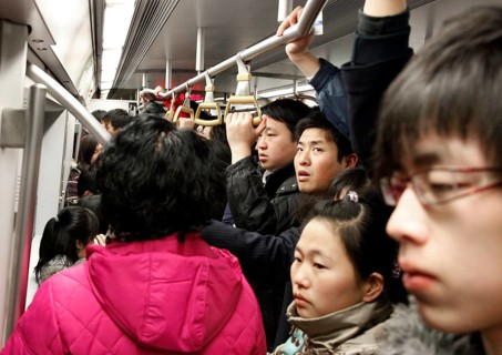 Beijing, CHN, 21.02.09 — Chinese passengers on a crowded subway in Beijing, CHINA