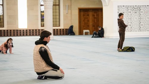 Muslims perform Tarawih prayers at the Millet Mosque, the second largest mosque in Turkey, which is