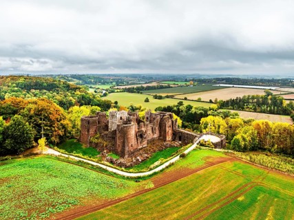 Autumn Colours over ruins of Goodrich Castle and River Wye from a drone, Goodrich, Herefordshire,