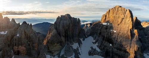 Impressive mountain peaks of the Brenta Mountains, sunrise, 360 degree alpine panorama, aerial