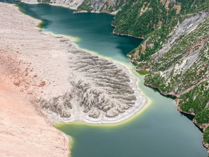 Lake with sandbank and dead trees, crater rim of chaiten volcano, aerial view, Patagonia, Chile