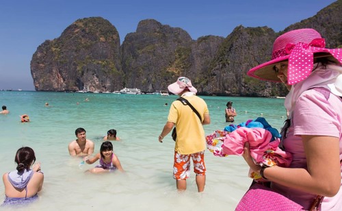 Phi Phi Island, Thailand, 04.02.2014 JE - Chinese tourists at Maya Bay, Phi Phi Islands, Thailand.