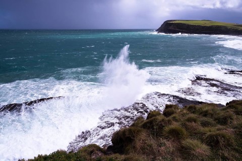 New Zealand, South Island of New Zealand, blue sea, ocean coast, dark sky, ominous sky, sea spray