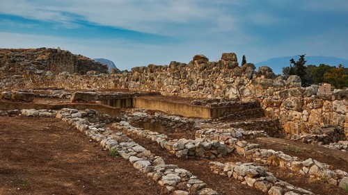 Convoluted stone ruins under an open sky in a setting steeped in history, Tiryns, ancient city in