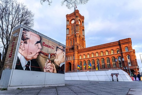 Red Town Hall in Berlin. Advertisement for the fast food chain Curry 61. Portrait of Erich Honecker