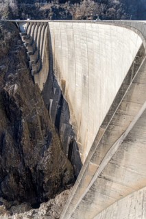 Aerial view of the iconic Contra Dam located in Verzasca, Ticino, Switzerland, showcasing the