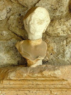 Ancient head of a marble statue, bust, fragment, Roman colony Cosa, former city of the Etruscans,