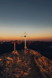 Summit cross, sunrise hiking tour on the Säuling in the Allgäu in Bavaria, Germany