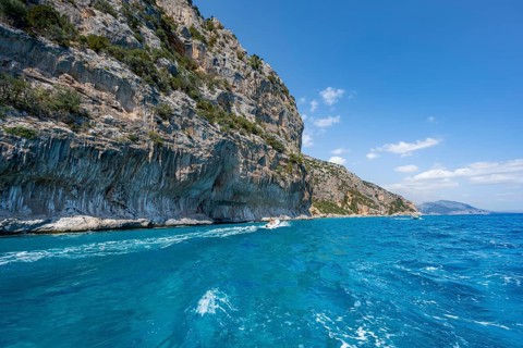 Picturesque rocky coast, cliffs and blue sea, Golfo di Orosei, Baunei, Sardinia, Italy