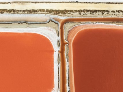 Saline ponds at the Bonanza salt works near Sanlúcar de Barrameda. The reddish colour depends on