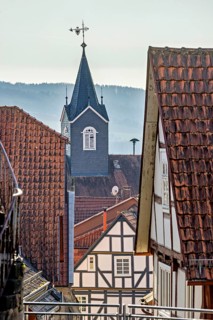 Picturesque old town with half-timbered houses and church tower, rustic atmosphere, church tower of