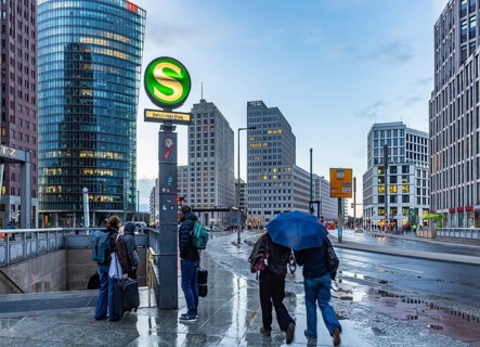 Potsdamer Platz Berlin in the evening with traffic on the streets. When it rains, the skyscrapers