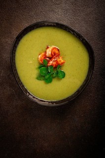 Pea cream soup, with shrimp, green soup, homemade, top view, no people