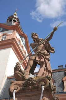 Neptune fountain with Neptune fighting a dragon and lance, baroque castle church and town church,