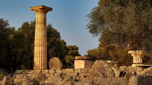 Temple of Zeus, ancient column next to ruins, surrounded by trees, archaeological site, Ancient