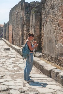 Tourist at the ruins in the archaeologic site of Pompei, UNESCO World Heritage Site, province of