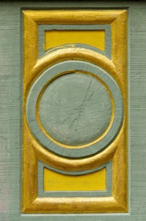 Decorative details on the frame of the medieval entrance portal at the New Town Hall of Freiburg im