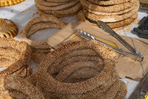 Traditional sesame seed bagels known as koulouria in Greek are a popular street food snack sold