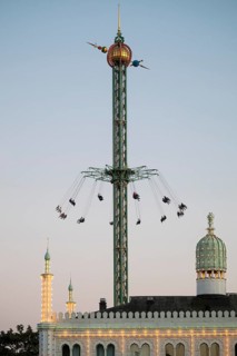 Star Flyer chain carousel at dusk, illuminated Nimb Restaurant, Tivoli Amusement and Recreation