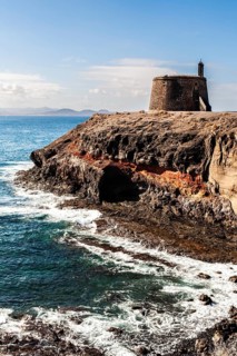 rocky promenade with fort, Playa Blanca, Lanzarote, Canary Islands, Spain