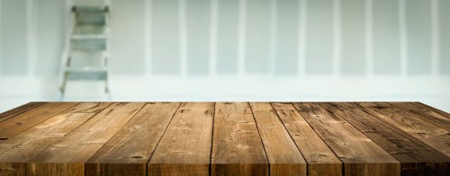 Empty Wood Table Surface Display Background with Construction Theme Behind