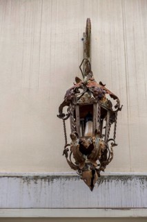 Rusted lantern on a house facade, Galatina, Apulia, Italy