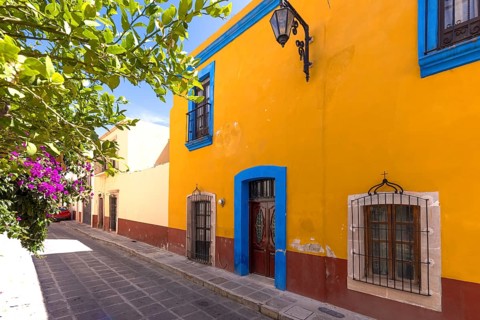 Colorful old city streets in historic city center of Zacatecas near central cathedral. It is a