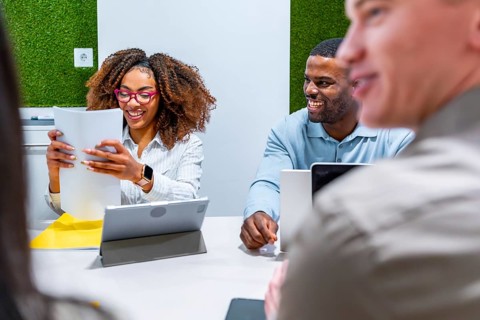 Business people collaborating on a project, sharing ideas and working together in a modern