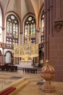 Interior view with baptismal font and chancel with folding altar High altar of the neo-Gothic St.