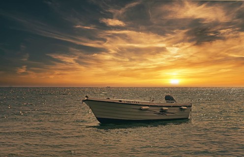 Small boat in the sunset, South Crete, Crete, Greece