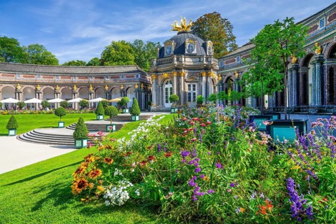 Flowerbeds in front of the New Palace with Temple of the Sun in the Hermitage Palace Park,