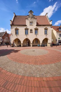 Old town hall against blue sky with cumulus clouds at the market square in Haltern am See, Ruhr
