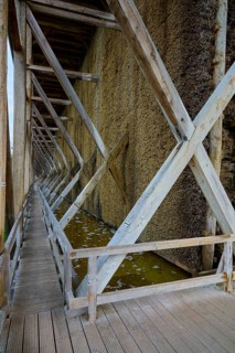 Wooden structure with graduation house and water basin, symmetrical perspective, spa town of Bad