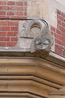 Sculpture above the door of the former Dolphin Inn, Winchester, Hampshire, England, United Kingdom