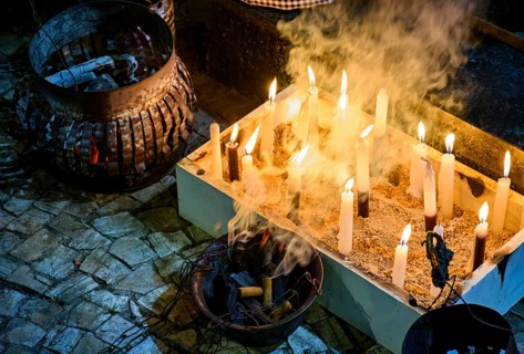 Smokers and candles as an offering to Umbanda entities in Brazil