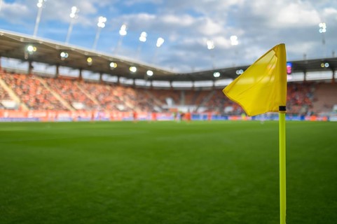 Flag in the corner of football pitch at the stadium during match in Lubin, Poland