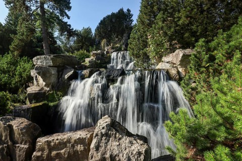Essen, North Rhine-Westphalia, Germany - Alpinum with waterfall, Grugapark, a park in Essen,