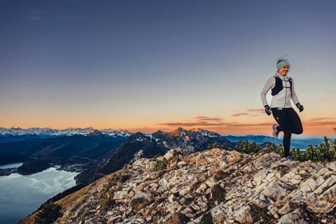 Trail running in autumn on the Jochberg on Lake Walchensee against the wonderful backdrop of the
