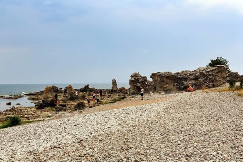Nature reserve with bizarre limestone formations, Raukar, hiker, coastline near Folhammar, east