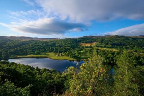 A vast landscape with a lake surrounded by green hills, Queens View, Fincastle, Pitlochry,
