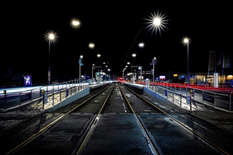 View of a light rail station along the tracks at night, elevated platform, stop, Krepenstasse,