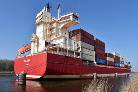 Averaged container ship FREDERIK stands at the dolphins in the Kiel Canal, Kiel Canal, Kiel Canal,